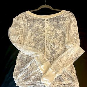 This is a white mesh top from the brand free people size large only worn once.